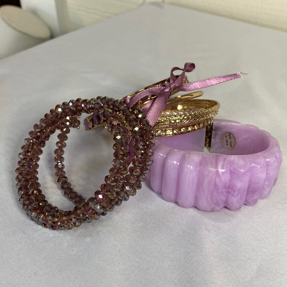 Group of 8 purple and Goldtone bracelets